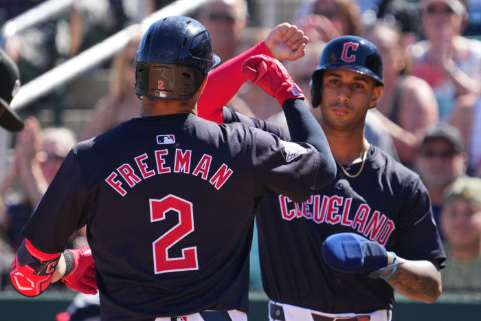 Mar 2, 2024; Goodyear, Arizona, USA; Cleveland Guardians third baseman Tyler Freeman (2) celebrates with Cleveland Guardians shortstop Brayan Rocchio (4) after hitting a home run against the Kansas City Royals during the first inning at Goodyear Ballpark. Mandatory Credit: Joe Camporeale-USA TODAY Sports